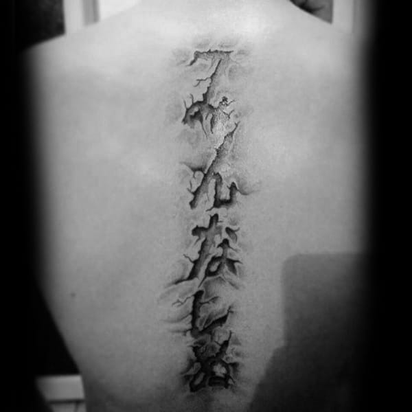 3d-torn-skin-spine-lettering-tattoos-for-guys