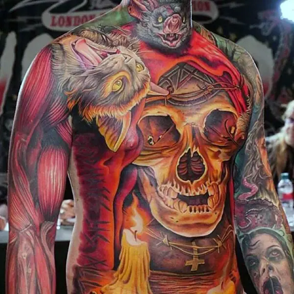 glowing-orange-skull-with-candle-mens-stomach-tattoo-ideas