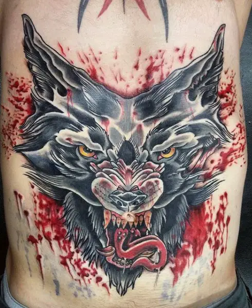 man-with-tattoo-on-stomach-of-bloody-wolf-design