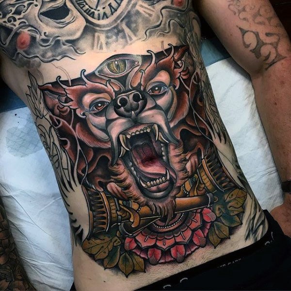 mens-tattoo-of-wolf-holding-torch-on-stomach