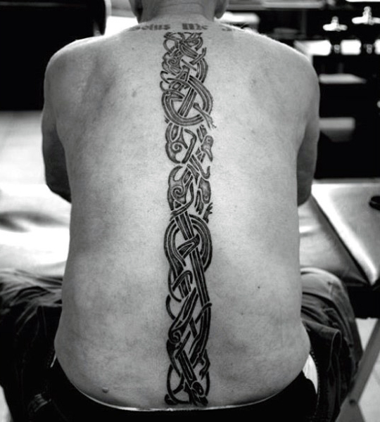 tribal-blackwork-mens-spine-tattoos