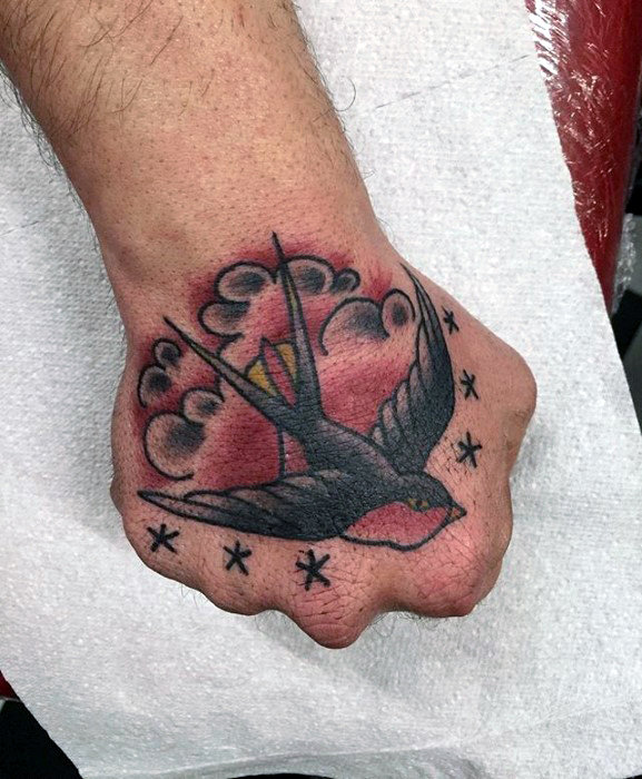 flying-sparrow-traditional-mens-hand-tattoo