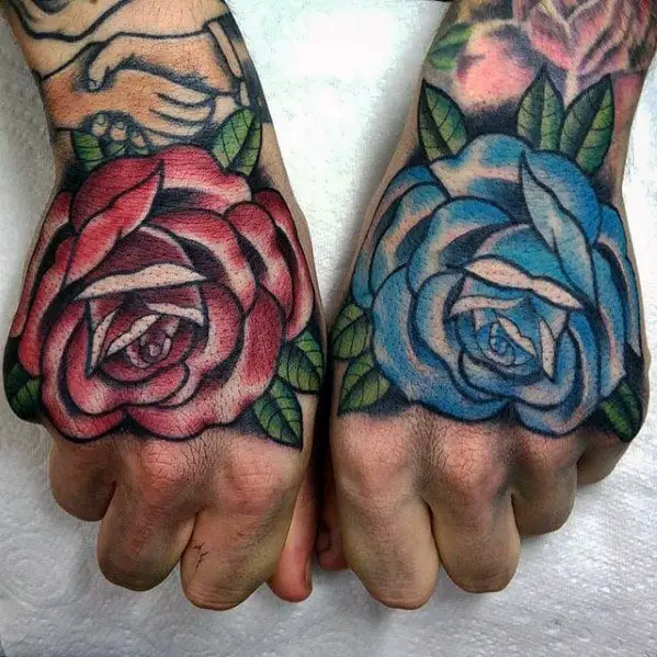 mens-hand-blue-and-red-rose-flowers-traditional-hand-tattoos