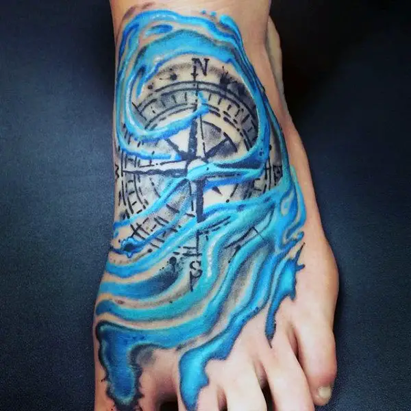 compass-with-azure-sea-waves-tattoo-on-foot-for-men