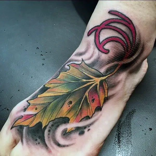 gorgeous-amber-colored-leaf-tattoo-foot-male