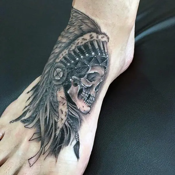 guy-with-tribal-skull-head-tattoo-on-foot