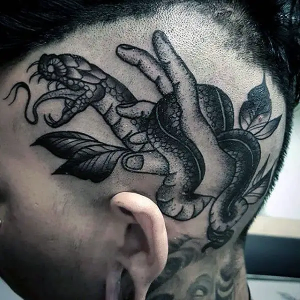 guys-hand-with-snake-head-tattoo