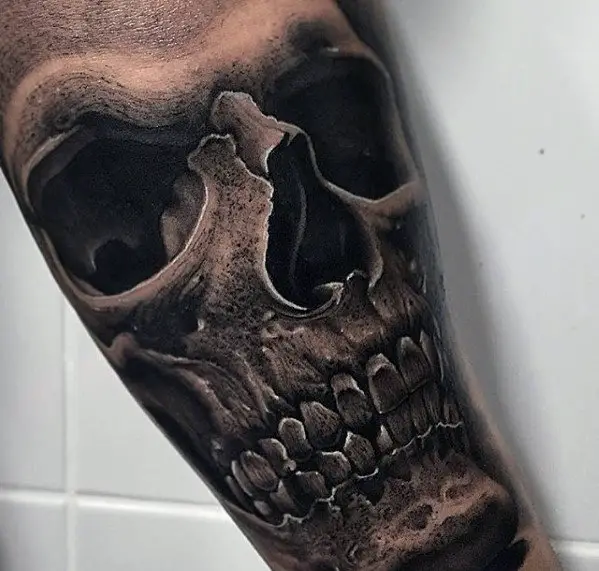 inner-arm-male-hyper-realistic-skull-tattoo