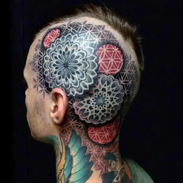 man-with-geometric-red-and-black-ink-head-tattoos