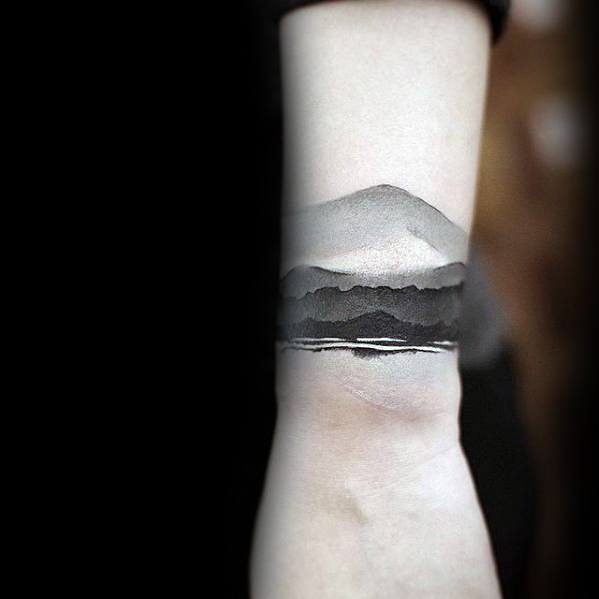 mountains-watercolor-black-and-grey-male-small-unique-wrist-tattoo-ideas