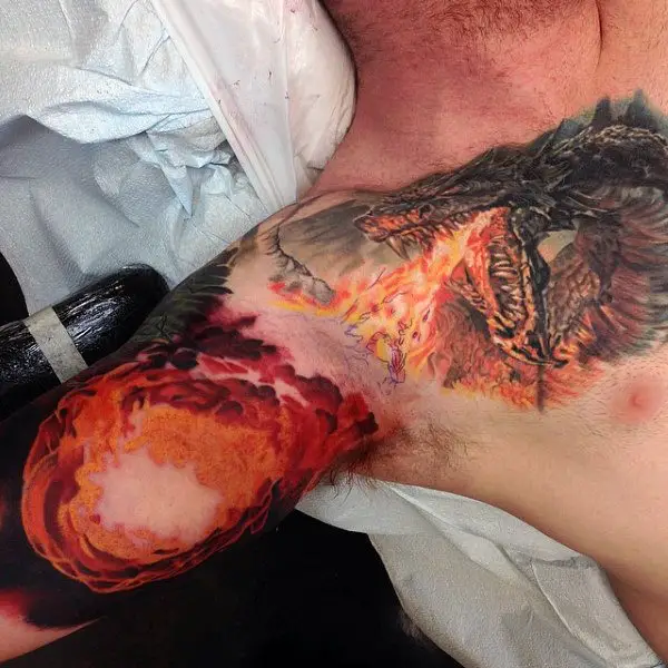 dragon-breathing-fireball-mens-chest-and-inner-arm-tattoos