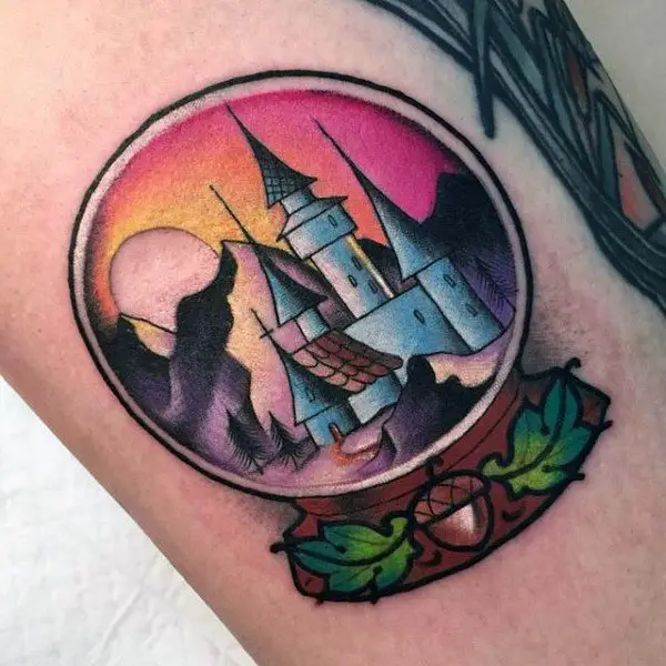 colorful-small-castle-snow-globe-tattoo-design-on-man