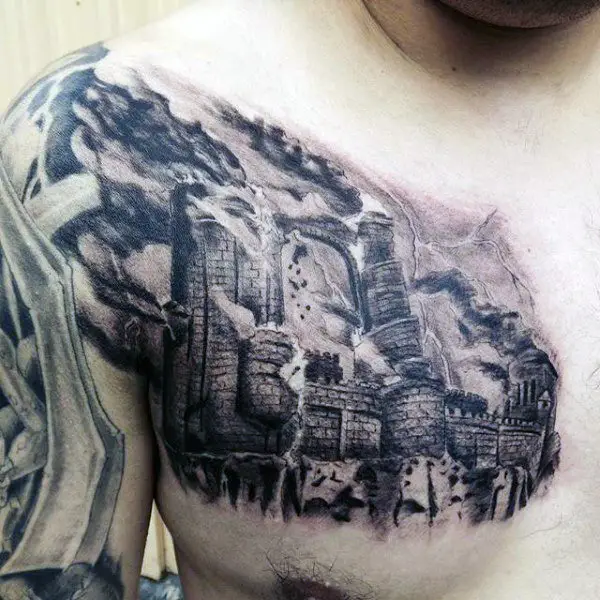 detailed-broken-castle-upper-chest-tattoo-for-men