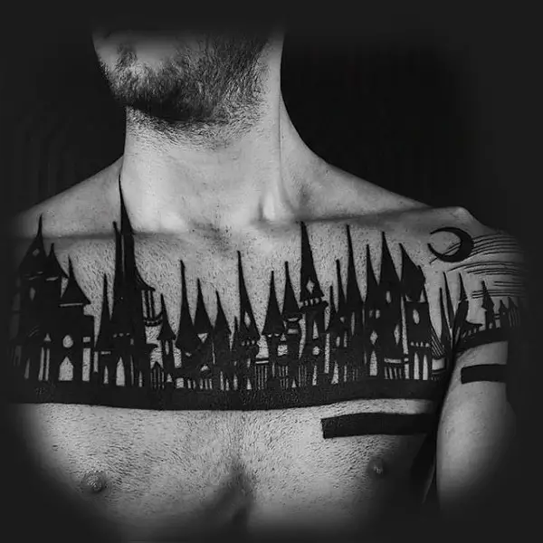 man-with-blackwork-castle-tattoo-on-chest