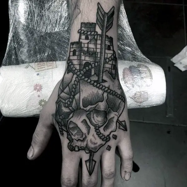 masculine-arrow-through-skull-castle-hand-tattoos-for-males