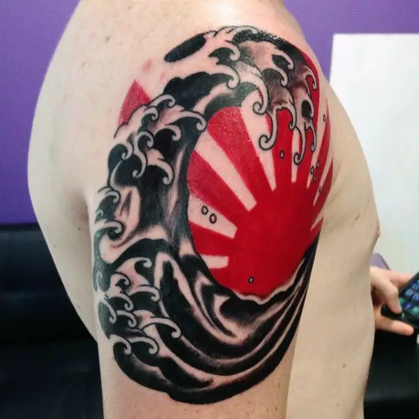 red-and-black-japanese-sun-tattoo-for-guys-on-upper-arm