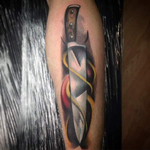 guys-forearms-knive-with-yellow-swirl-culinary-tattoo
