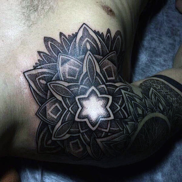 amazing-male-chest-impressive-black-dotwork-tattoo-with-bright-white-centre