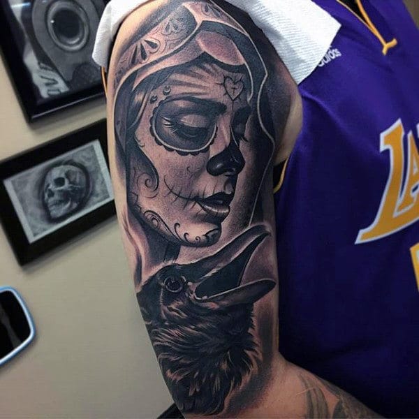 day-of-the-dead-themed-black-ink-mens-half-sleeve-tattoo-with-crow
