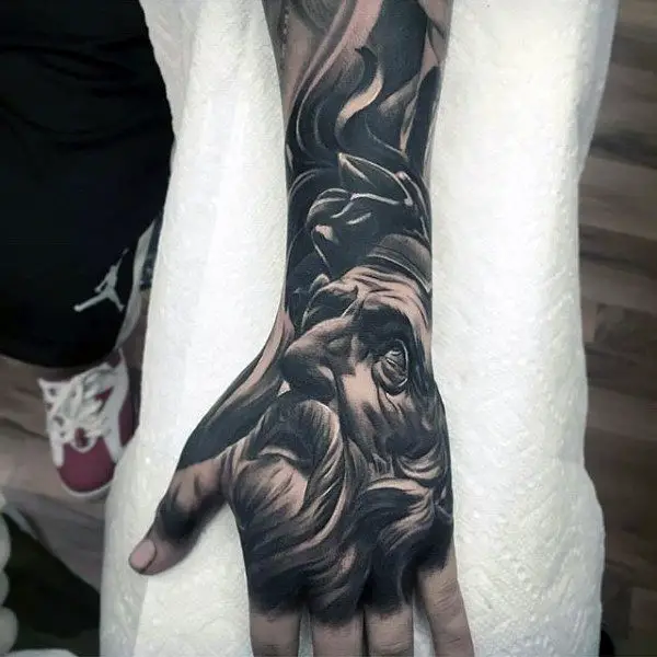 man-portrait-black-ink-hand-tattoo