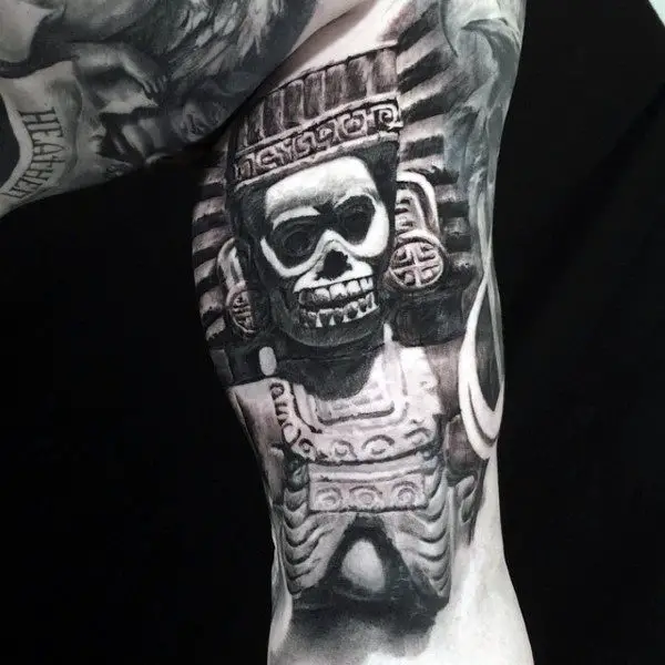 man-with-ethnic-idol-tattoo-on-quarter-sleeves