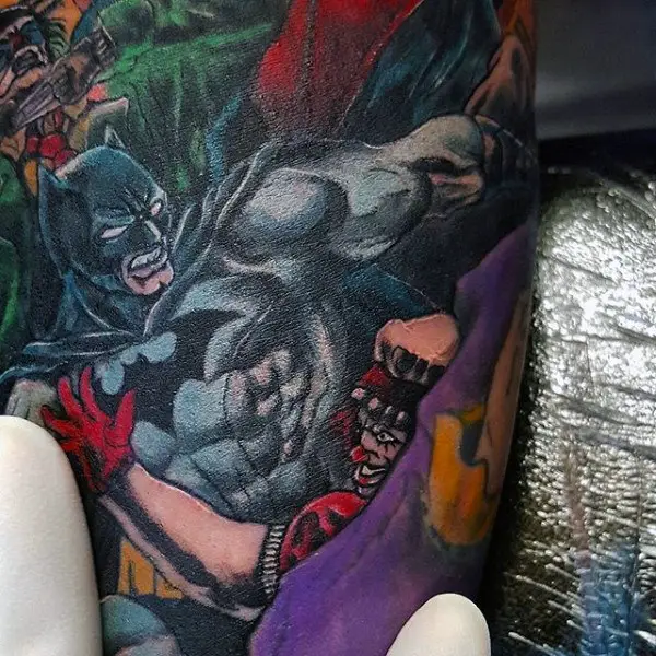 batman-in-action-mens-traditional-bicep-tattoo-design-with-full-color