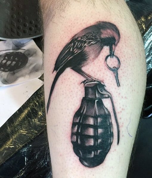bird-with-grenade-pin-mens-tattoo