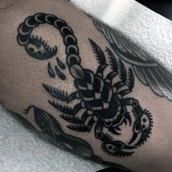 black-and-grey-male-arm-traditional-tattoo-with-scorpion-design