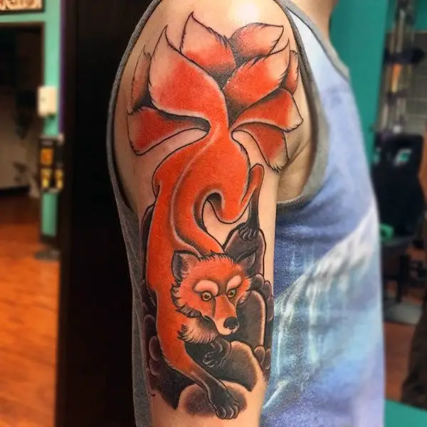 fluffy-tailed-orange-fox-tattoo-mens-upper-arms
