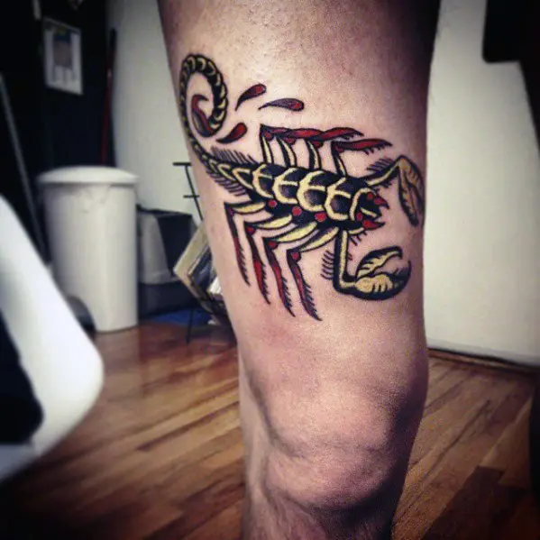 guy-with-black-red-and-yellow-traditional-scorpion-on-thigh-of-leg