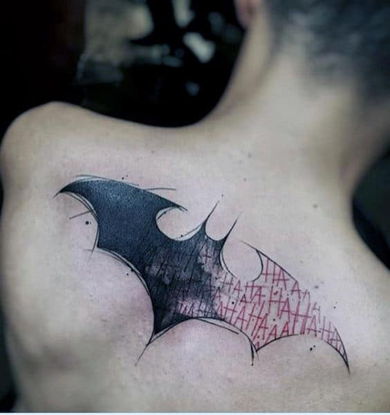 guys-upper-back-batman-symbol-with-ha-ha-lettering-design-tattoo