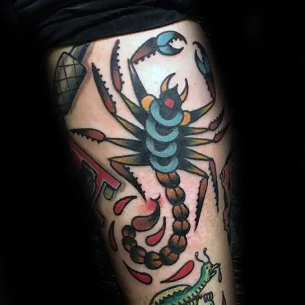 man-with-arm-traditional-scorpion-tattoo