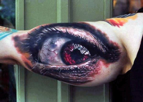man-with-tattoo-of-realistic-optical-illusion-eye-on-bicep