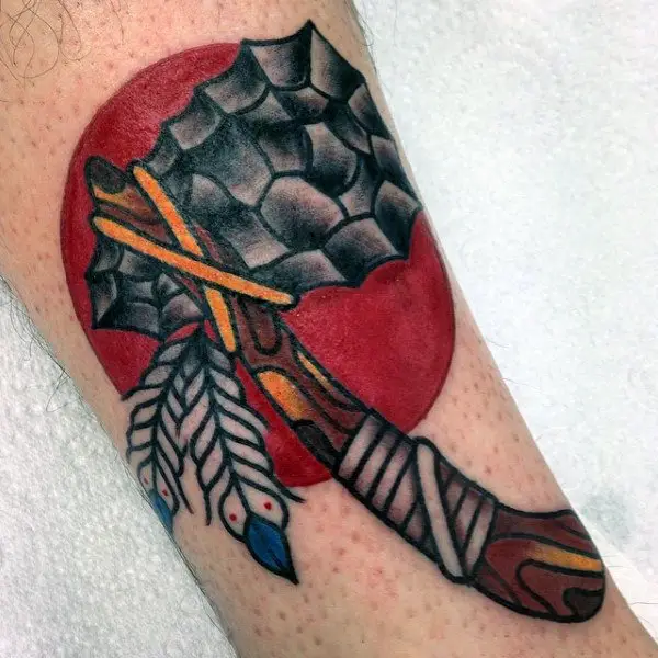 american-indian-tomahawk-tattoo-with-red-rising-sun-on-mans-arm