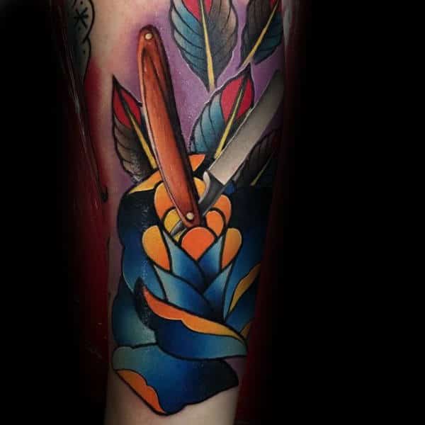 beautiful-dark-blue-rose-with-yellow-inner-shades-and-straight-razor-tattoo-male-forearms