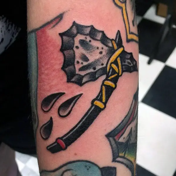 black-tomahawk-tattoo-with-yellow-cord-for-men-on-arm