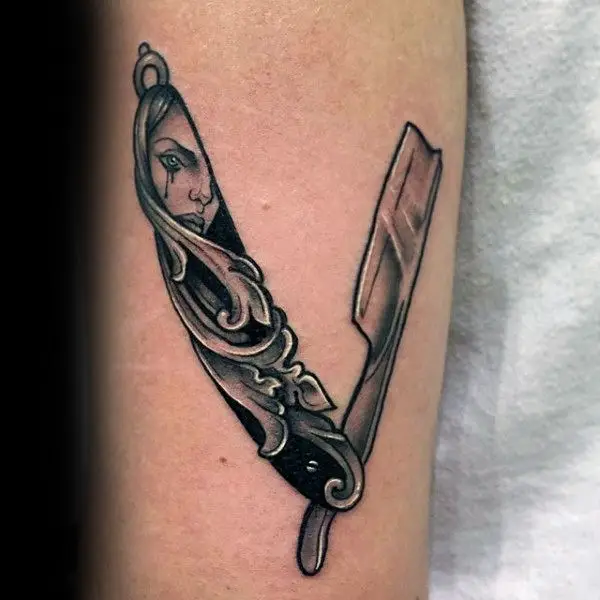carved-tear-stained-face-of-young-girl-straight-razor-tattoo-male-forearms