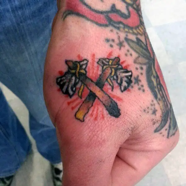 cool-double-tomahawks-crossed-together-guys-hand-tattoo-above-the-knuckle