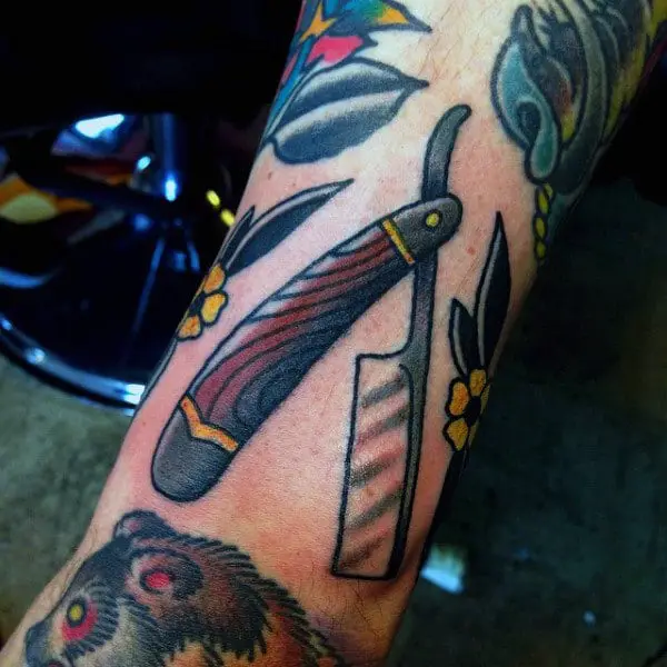 impressive-straight-razor-tattoo-male-forearms