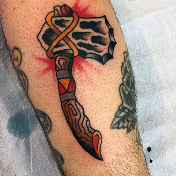 male-with-small-tomahawk-tattoo-old-school-design-style
