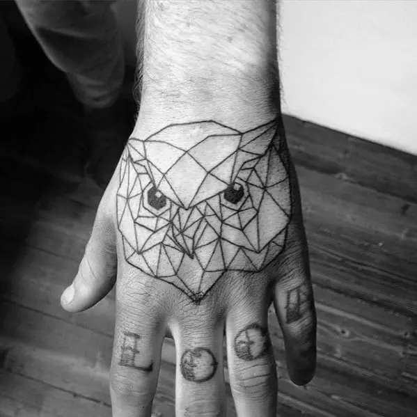 black-ink-outline-geometric-owl-hand-tattoo-on-man