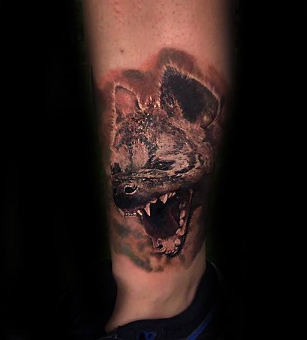 guy-with-hyena-tattoo-design-on-forearm
