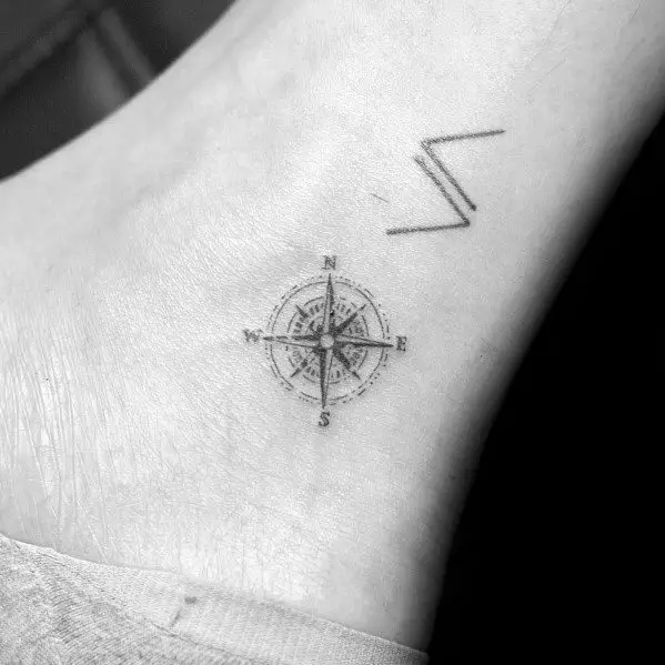 guy-with-simple-compass-ankle-tattoo