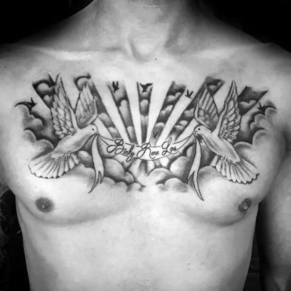 mens-chest-tattoo-of-doves-holding-banner-in-clouds