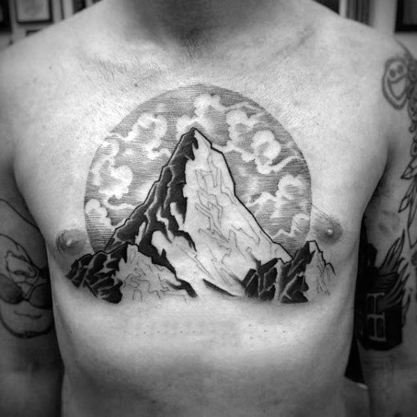 mountain-top-clouds-guys-chest-tattoo