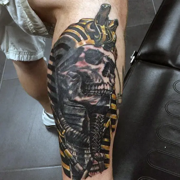 skull-faced-king-tut-mens-leg-tattoos