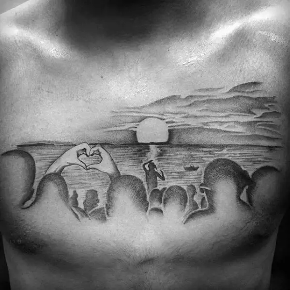 sunset-beach-scene-cloudy-sky-male-shaded-chest-tattoo