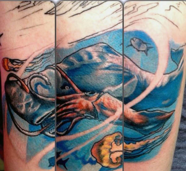 incredible-shark-eating-squid-underwater-mens-tattoo-on-arm