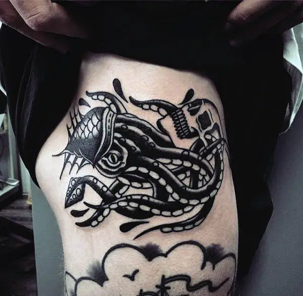 man-with-awesome-black-squid-tattoo-and-skull-design
