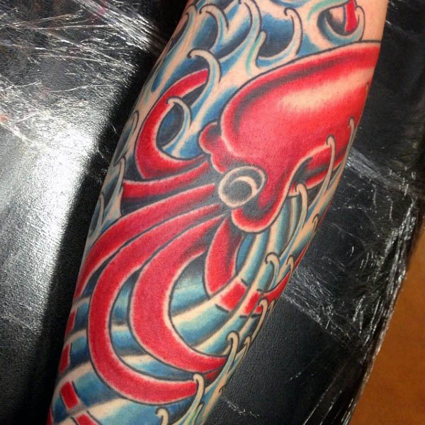 red-squid-with-blue-ocean-waves-tattoo-for-men-on-arm
